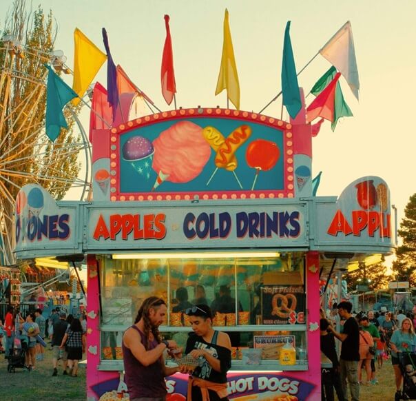 Amusement park guests pay for concessions with cashless cards